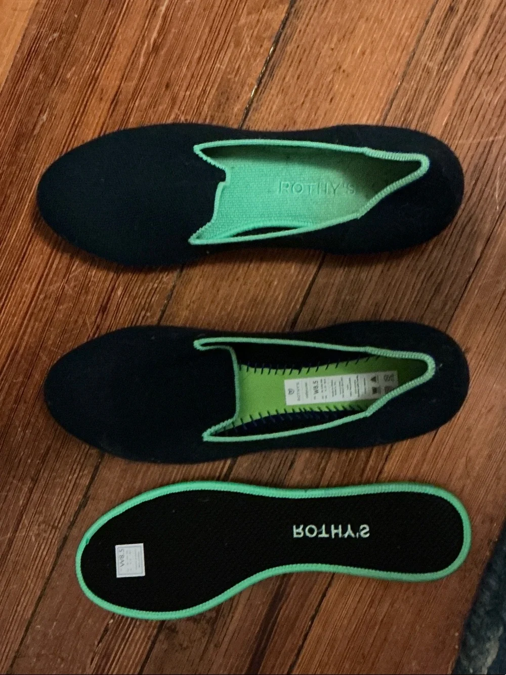 Rothy's Black Slip-On Loafers with Bright Green Interior